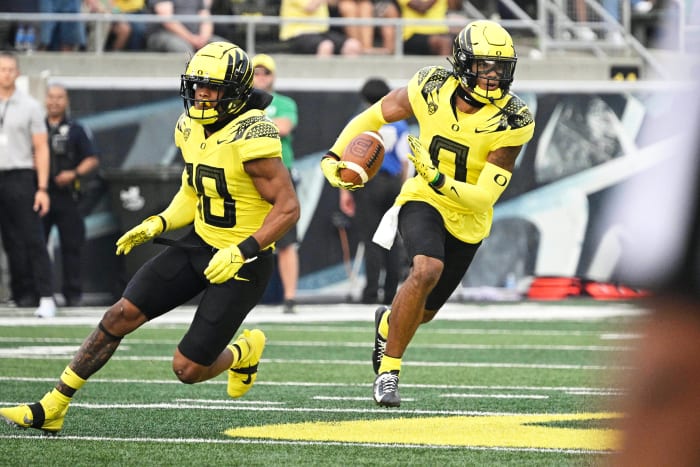 Oregon Ducks cornerback Christian Gonzalez returns an interception against the Eastern Washington Eagles at Autzen Stadium.